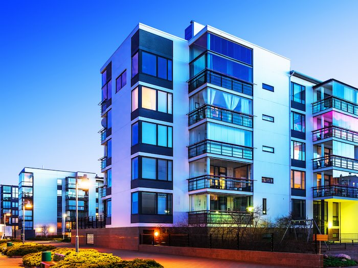 corporate housing rental building under an indigo sky